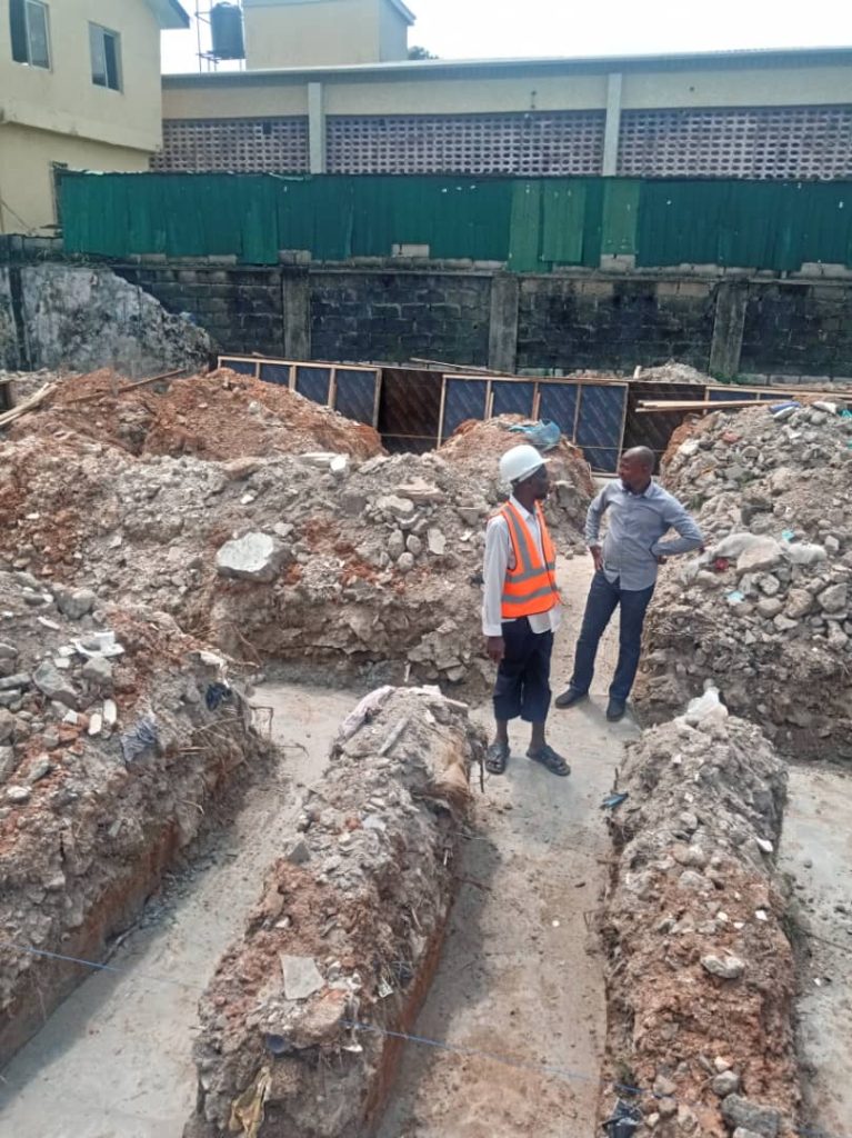 Renovation team in Lagos repairing and repainting a Nigerian residential building