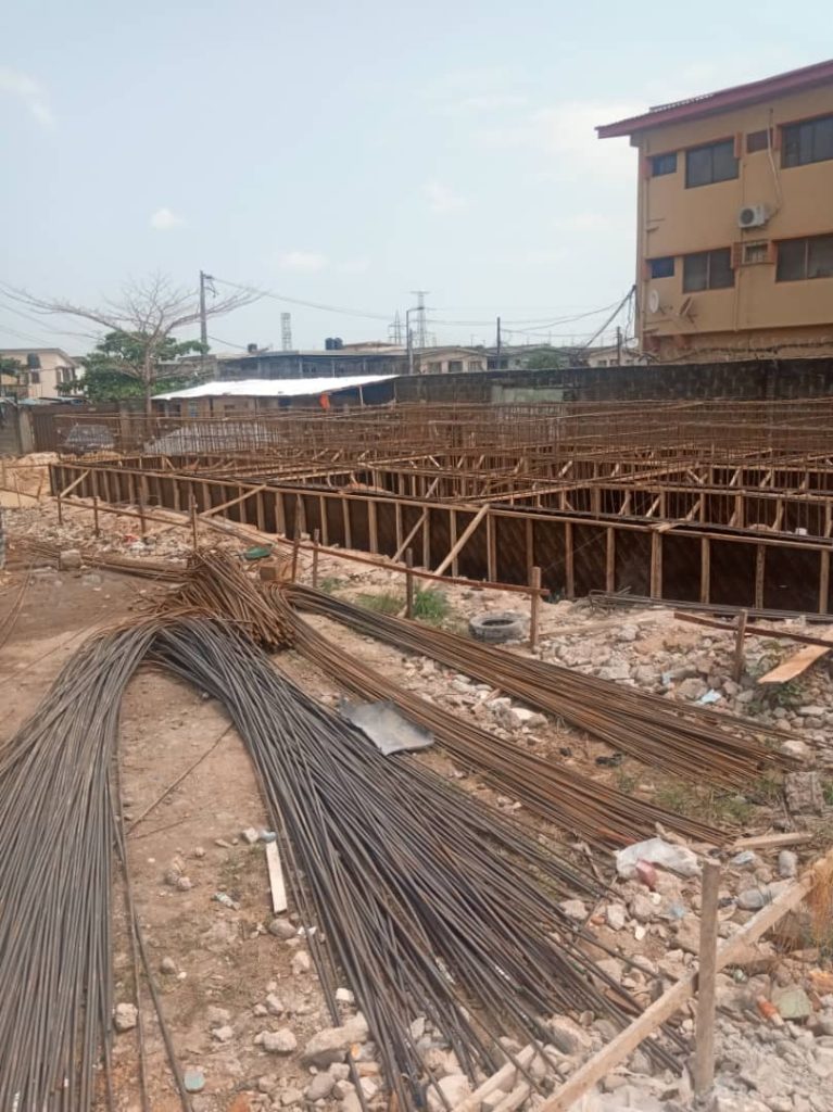 Residential building services team in Nigeria installing roofing tiles