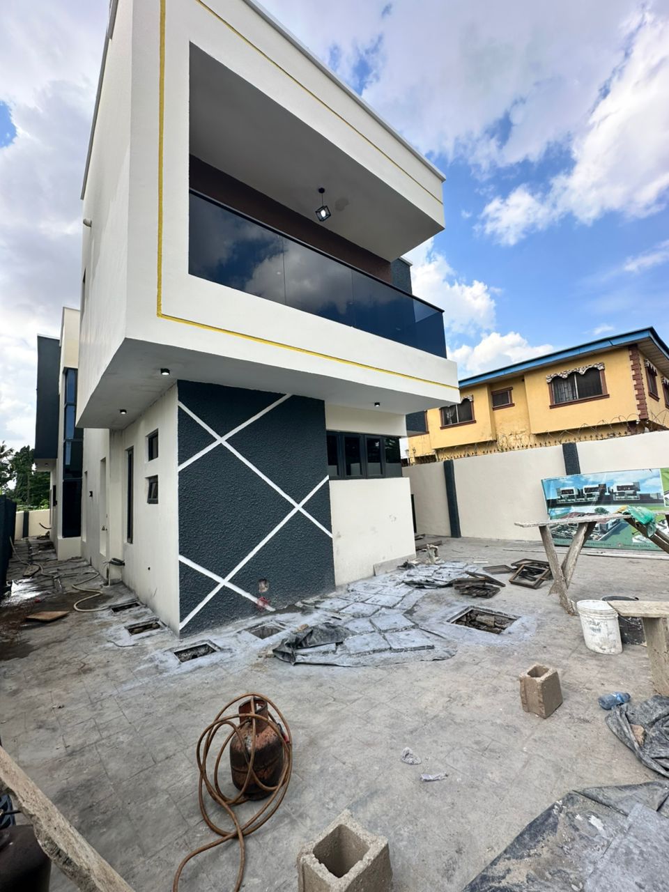 Affordable house construction site in Nigeria with local workers and materials